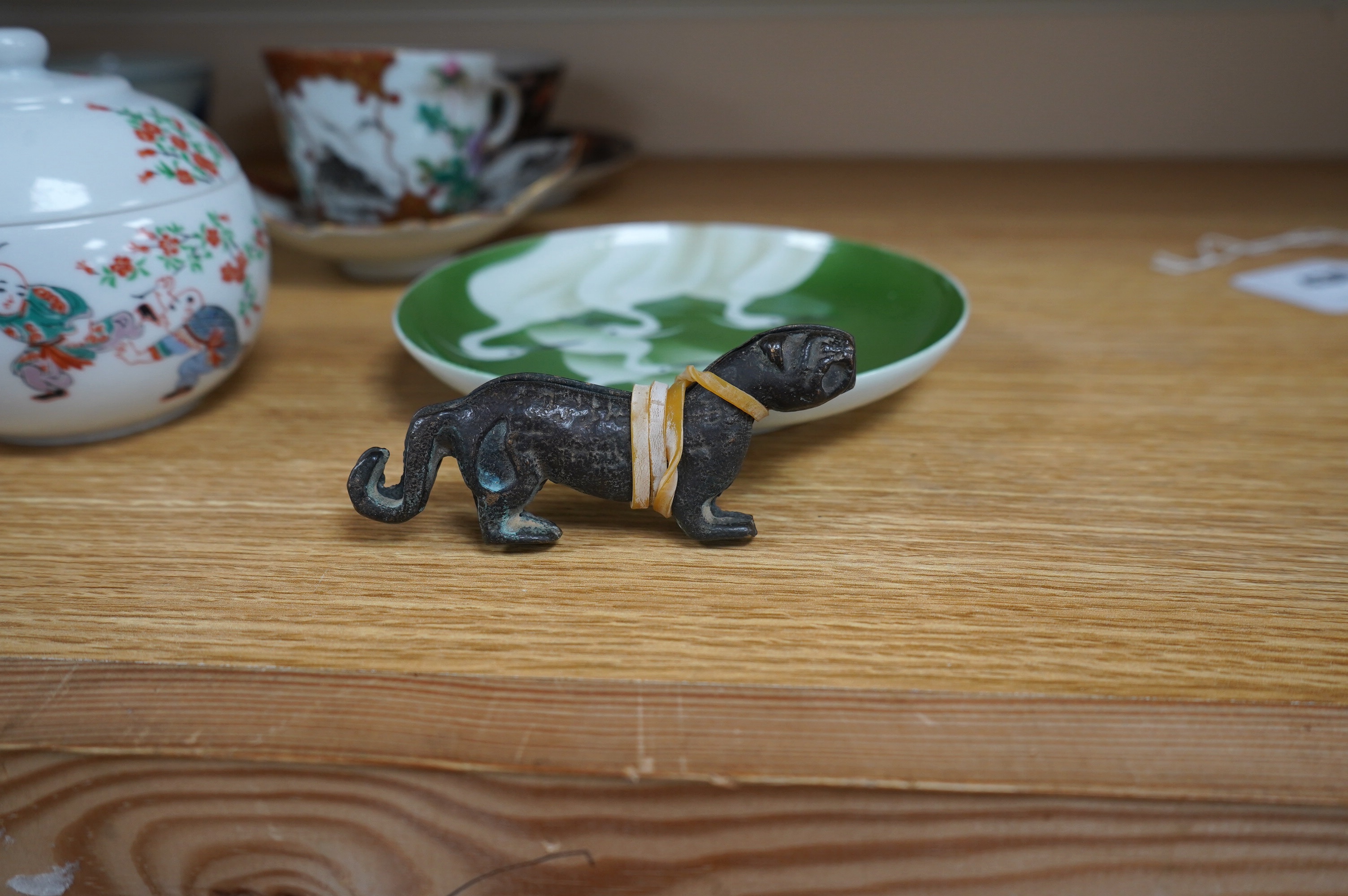 A group of Chinese and Japanese ceramics to include Yixing teapots, porcelain cups and saucers, a blue and white vase and a tiger talisman. Condition - mostly good